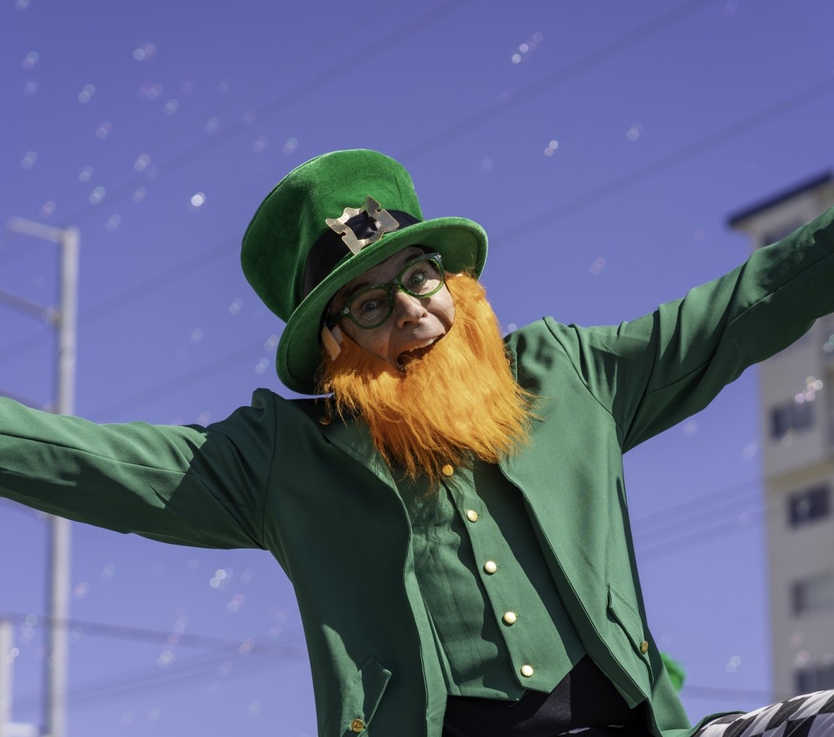 Man dressed as a Leprechaun on stilts